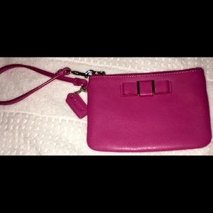 NWOT Pretty in Pink Coach Wristlet. Cute pink bow.